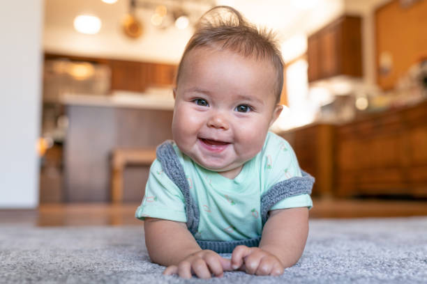 Baby laying on carpet floorings | LA Carpet Warehouse, Inc